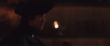Movie still from “The Affair of the Necklace” (2001), directed by Charles Shyer – A man in a military uniform looking at a flower; Close Up shot, Over the shoulder angle