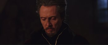 Movie still from “The Affair of the Necklace” (2001), directed by Charles Shyer – A person with a beard; Close Up shot, Low angle