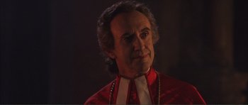 Movie still from “The Affair of the Necklace” (2001), directed by Charles Shyer – A person wearing a red shirt; Close Up shot, Over the shoulder angle