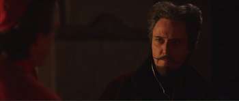 Movie still from “The Affair of the Necklace” (2001), directed by Charles Shyer – A person wearing a headset; Close Up shot, Low angle