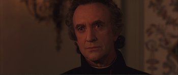 Movie still from “The Affair of the Necklace” (2001), directed by Charles Shyer – A person wearing a black shirt; Close Up shot, Low angle