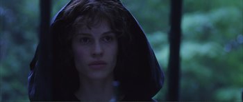 Movie still from “The Affair of the Necklace” (2001), directed by Charles Shyer – A woman with a black hood is looking at the camera; Close Up shot, Low angle