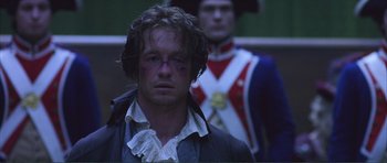 Movie still from “The Affair of the Necklace” (2001), directed by Charles Shyer – A man in a blue jacket and a man in a red and blue jacket; Close Up shot, Low angle