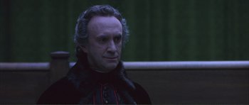 Movie still from “The Affair of the Necklace” (2001), directed by Charles Shyer – A person sitting on a bench; Close Up shot, High angle