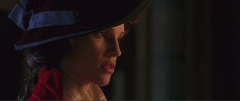 Movie still from “The Affair of the Necklace” (2001), directed by Charles Shyer – A person wearing a hat; Close Up shot, Low angle