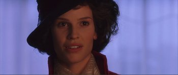 Movie still from “The Affair of the Necklace” (2001), directed by Charles Shyer – A person wearing a hat; Close Up shot, Over the shoulder angle
