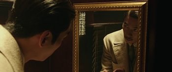 Movie still from “The Age of Shadows” (2016), directed by Jee-woon Kim – A man looking at himself in the mirror; Close Up shot, Over the shoulder angle
