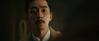 A person wearing a suit and tie