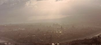 Movie still from “The Agony and the Ecstasy” (1965), directed by Carol Reed – A view of a city from a hill with fog; Extreme Wide shot, High angle