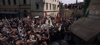 Movie still from “The Agony and the Ecstasy” (1965), directed by Carol Reed – A crowd of people are gathered around a stage; Extreme Wide shot, High angle