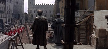 Movie still from “The Agony and the Ecstasy” (1965), directed by Carol Reed – Two men in medieval garb looking out over a city; Wide shot, High angle