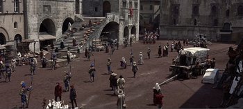 Movie still from “The Agony and the Ecstasy” (1965), directed by Carol Reed – A group of people walking in a field; Extreme Wide shot, High angle