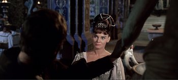 Movie still from “The Agony and the Ecstasy” (1965), directed by Carol Reed – A woman in a dress with a crown on her head; Close Up shot, Over the shoulder angle