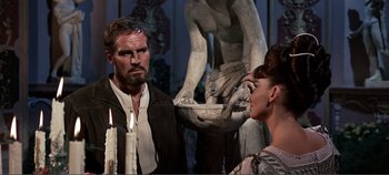Movie still from “The Agony and the Ecstasy” (1965), directed by Carol Reed – A man and a woman in front of a statue; Medium shot, Over the shoulder angle