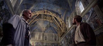 Movie still from “The Agony and the Ecstasy” (1965), directed by Carol Reed – Two men are standing in front of a ceiling; Wide shot, Low angle