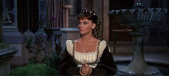 Movie still from “The Agony and the Ecstasy” (1965), directed by Carol Reed – A woman in a medieval dress looking at the camera; Close Up shot, High angle