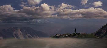 Movie still from “The Agony and the Ecstasy” (1965), directed by Carol Reed – A man standing on a rock in the middle of a valley; Extreme Wide shot, High angle