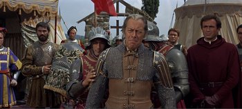 Movie still from “The Agony and the Ecstasy” (1965), directed by Carol Reed – A group of men in medieval costumes standing next to each other; Medium shot, Low angle