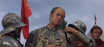 Movie still from “The Agony and the Ecstasy” (1965), directed by Carol Reed – A person wearing a suit of armor; Close Up shot, Low angle