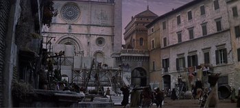 Movie still from “The Agony and the Ecstasy” (1965), directed by Carol Reed – A group of people standing next to each other on a street; Extreme Wide shot, Low angle