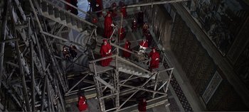 Movie still from “The Agony and the Ecstasy” (1965), directed by Carol Reed – A group of people dressed in red standing on a set of stairs; Extreme Wide shot, Overhead angle