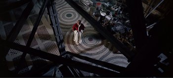 Movie still from “The Agony and the Ecstasy” (1965), directed by Carol Reed – An old man sitting on a chair in a room; Extreme Wide shot, Overhead angle