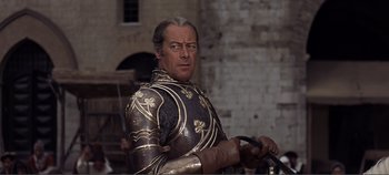 Movie still from “The Agony and the Ecstasy” (1965), directed by Carol Reed – A person wearing a suit of armor; Medium shot, Low angle