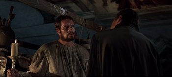 Movie still from “The Agony and the Ecstasy” (1965), directed by Carol Reed – A man with a beard is standing next to another man; Medium shot, Over the shoulder angle