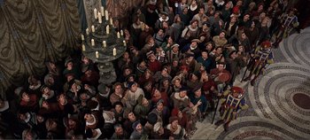 Movie still from “The Agony and the Ecstasy” (1965), directed by Carol Reed – An overhead view of a group of people gathered in a church; Wide shot, High angle