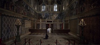 Movie still from “The Agony and the Ecstasy” (1965), directed by Carol Reed – A man and a woman are standing in an empty church; Extreme Wide shot, High angle