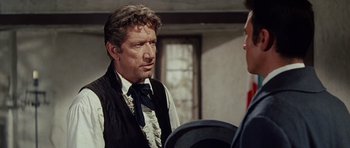 Movie still from “The Alamo” (1960), directed by John Wayne – A person talking to another person; Close Up shot, Over the shoulder angle