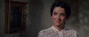 Movie still from “The Alamo” (1960), directed by John Wayne – A person wearing a white shirt; Close Up shot, Over the shoulder angle