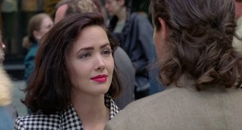 Movie still from “The Ambulance” (1990), directed by Larry Cohen – A woman with red lipstick talking to a man; Close Up shot, Over the shoulder angle