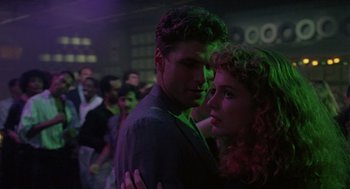 Movie still from “The Ambulance” (1990), directed by Larry Cohen – A man and a woman standing next to each other; Close Up shot, Low angle