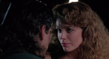 Movie still from “The Ambulance” (1990), directed by Larry Cohen – A man and a woman looking at one another; Close Up shot, Over the shoulder angle