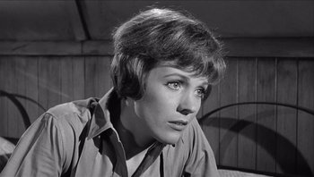 Movie still from “The Americanization of Emily” (1964), directed by Arthur Hiller – A black - and - white photo of a woman with short hair; Close Up shot, Low angle