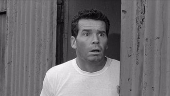 Movie still from “The Americanization of Emily” (1964), directed by Arthur Hiller – Black and white photograph of a man with a surprised look on his face; Close Up shot, Low angle