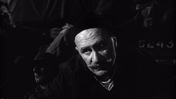 Movie still from “The Americanization of Emily” (1964), directed by Arthur Hiller – An old man with a beard and mustache wearing a hat; Close Up shot, High angle