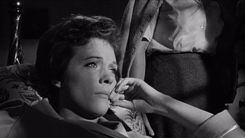 Movie still from “The Americanization of Emily” (1964), directed by Arthur Hiller – An old photo of a woman getting her teeth brushed; Close Up shot, High angle