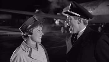 Movie still from “The Americanization of Emily” (1964), directed by Arthur Hiller – A man and a woman are talking to each other; Medium shot, Low angle