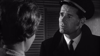 Movie still from “The Americanization of Emily” (1964), directed by Arthur Hiller – A man in a hat and a suit talking to a woman; Close Up shot, Over the shoulder angle
