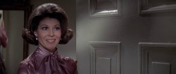 Movie still from “The Andromeda Strain” (1971), directed by Robert Wise – A person wearing a dress; Close Up shot, Over the shoulder angle