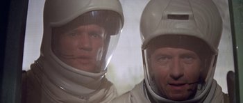 Movie still from “The Andromeda Strain” (1971), directed by Robert Wise – Two men in white suits and white helmets; Close Up shot, Low angle