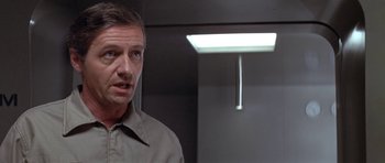 Movie still from “The Andromeda Strain” (1971), directed by Robert Wise – A person standing in front of a light; Close Up shot, Low angle