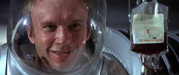 Movie still from “The Andromeda Strain” (1971), directed by Robert Wise – A person wearing a space suit; Close Up shot, Low angle