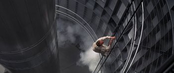 Movie still from “The Andromeda Strain” (1971), directed by Robert Wise – A man climbing up the side of an escalator; Wide shot, Overhead angle