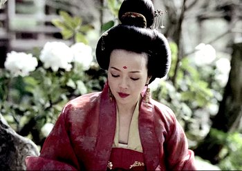 Movie still from “The Assassin” (2015), directed by Hsiao-Hsien Hou – A geisha in a red kimono is looking down at the ground; Close Up shot, Low angle