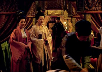 Movie still from “The Assassin” (2015), directed by Hsiao-Hsien Hou – A group of people dressed in traditional japanese clothing; Medium shot, Over the shoulder angle
