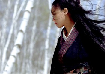 Movie still from “The Assassin” (2015), directed by Hsiao-Hsien Hou – A young woman in a traditional chinese outfit; Medium shot, Low angle