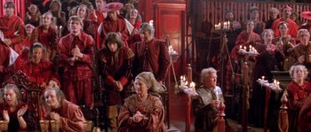 Movie still from “The Baby of Mâcon” (1993), directed by Peter Greenaway – A group of people dressed in medieval clothing; Wide shot, High angle